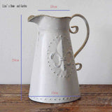 broc ancien en metal